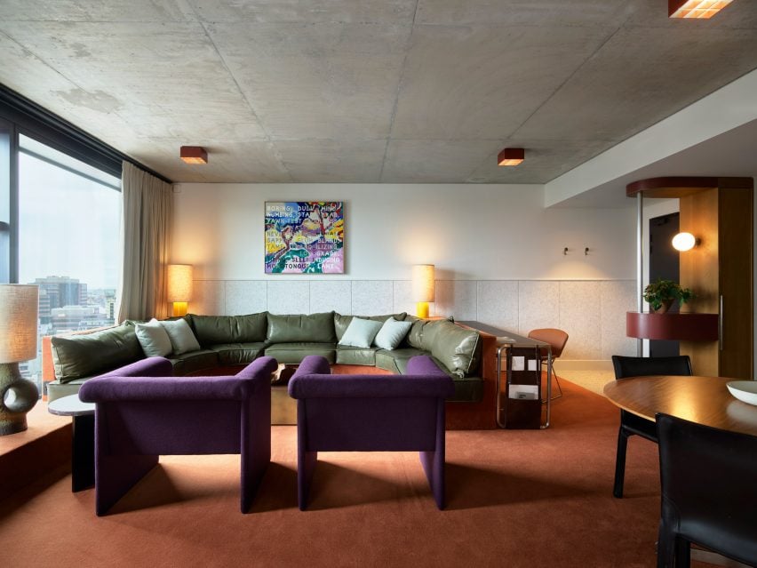 Guest suite with green and purple seating in Ace Hotel Sydney