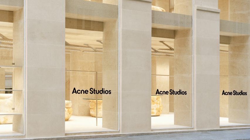 Image of the store through the Acne Studios branded windows