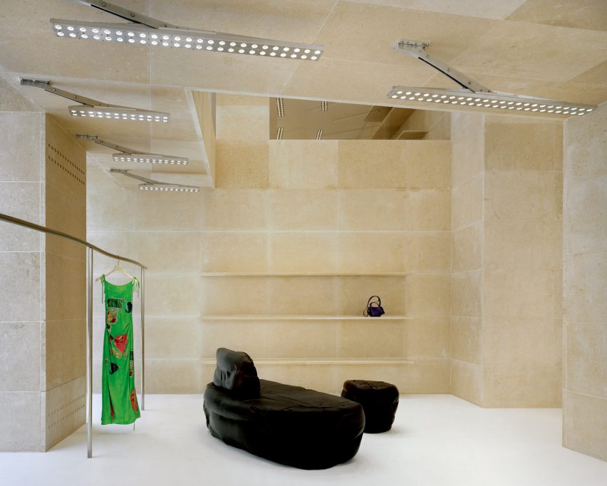 Interior image of amorphous-shaped Max Lamb furniture within the Acne Studios Rue Saint Honoré