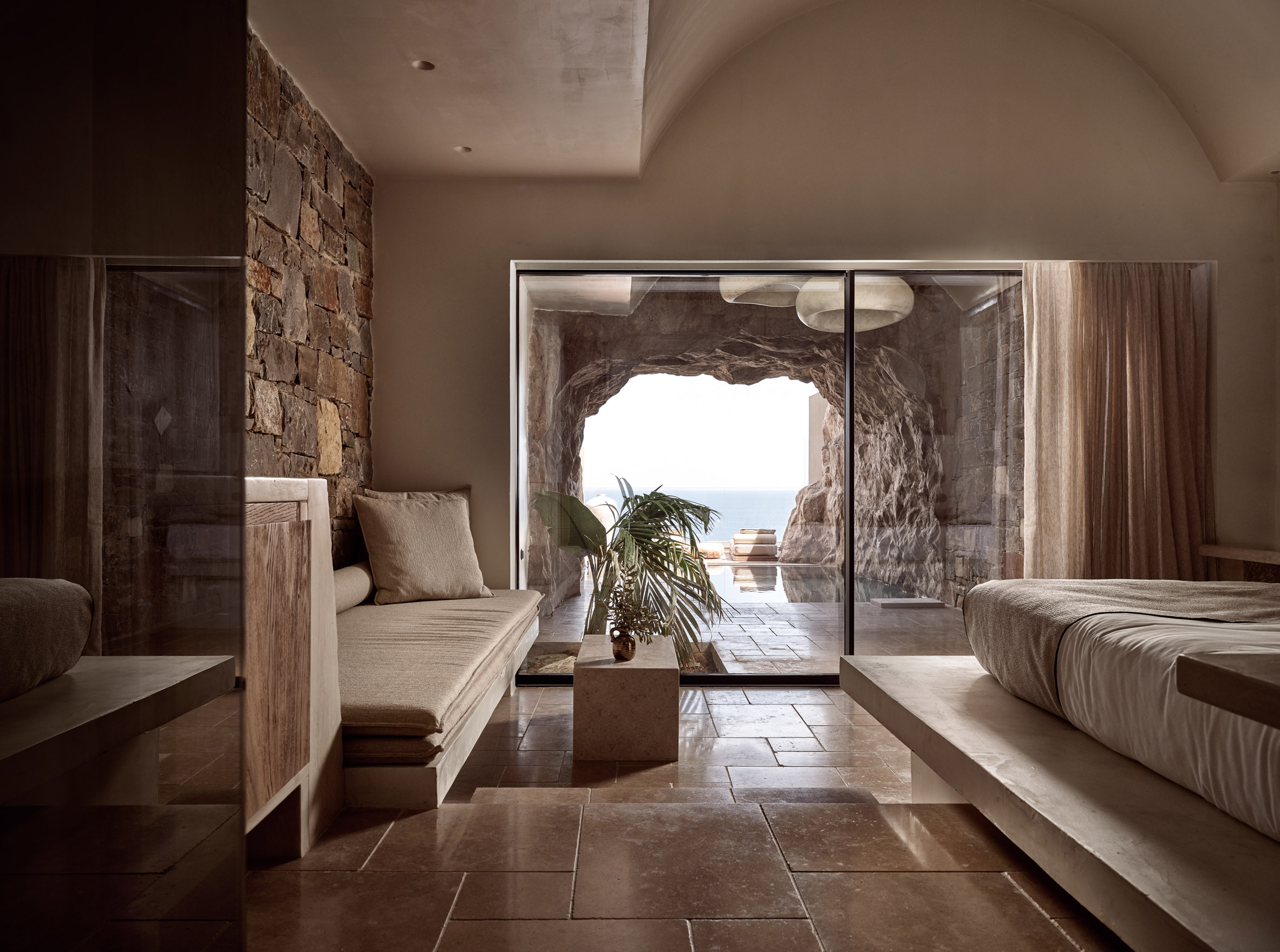 Suite with cave-like entrance in hotel on Crete by the Orfanake sisters