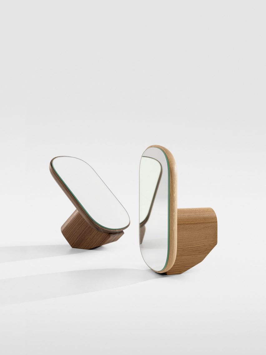 Two Ad Mire vanity mirrors titled at different angles