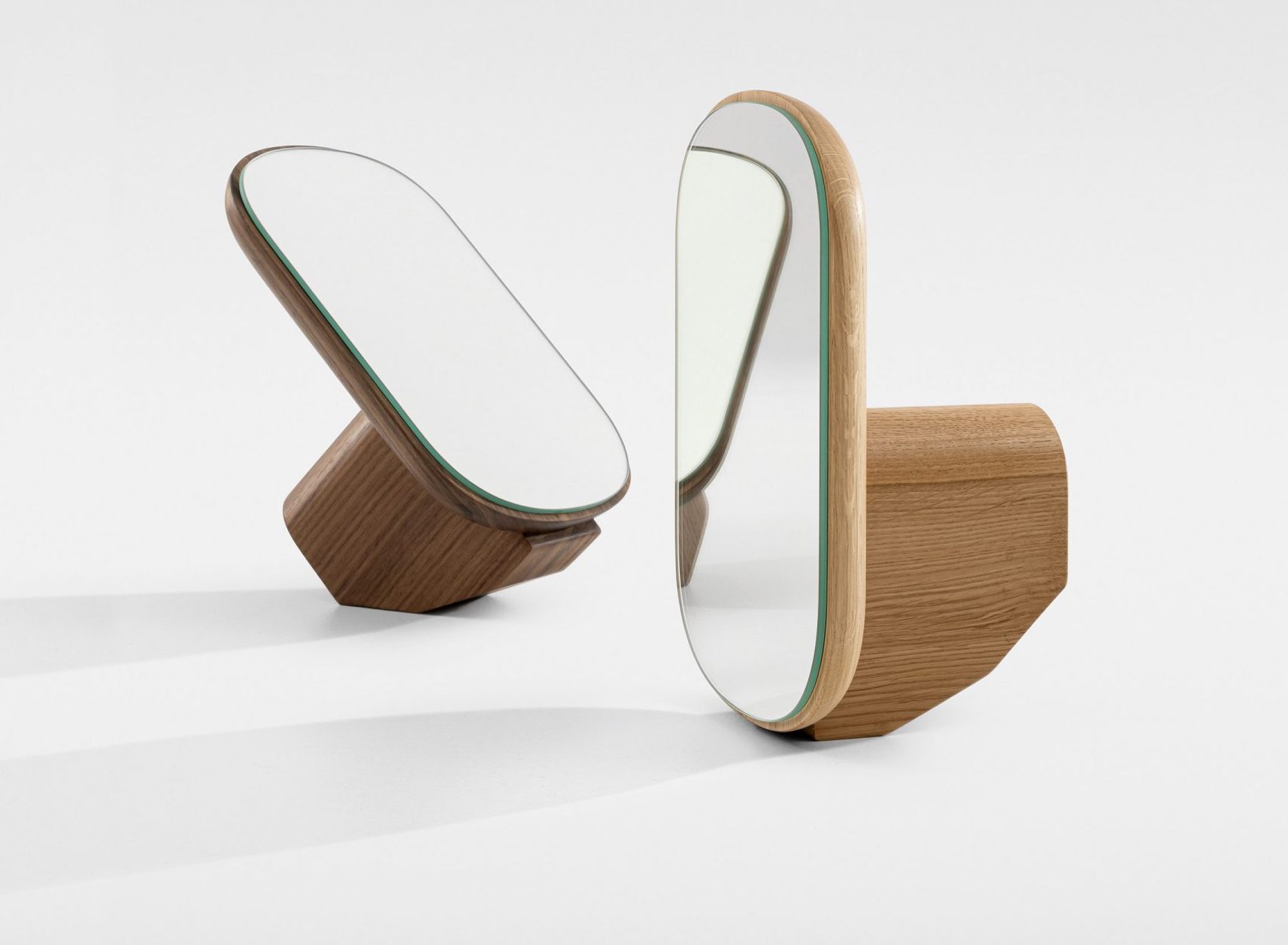 Two Ad Mire vanity mirrors titled at different angles