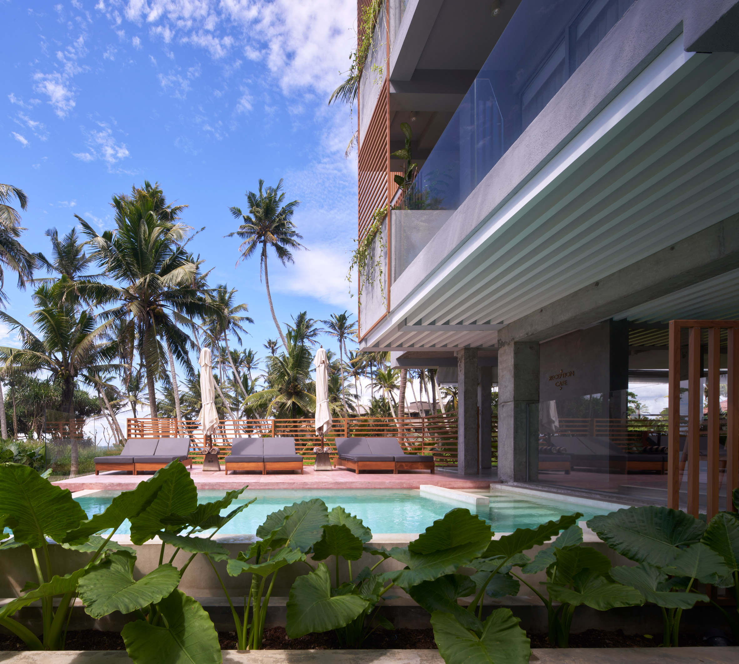Pool outside a tropical hotel