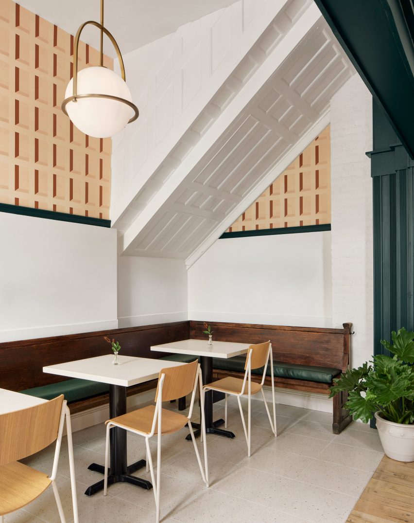 Cozy seating area of Lebanese restaurant in Brooklyn with patterns and green details