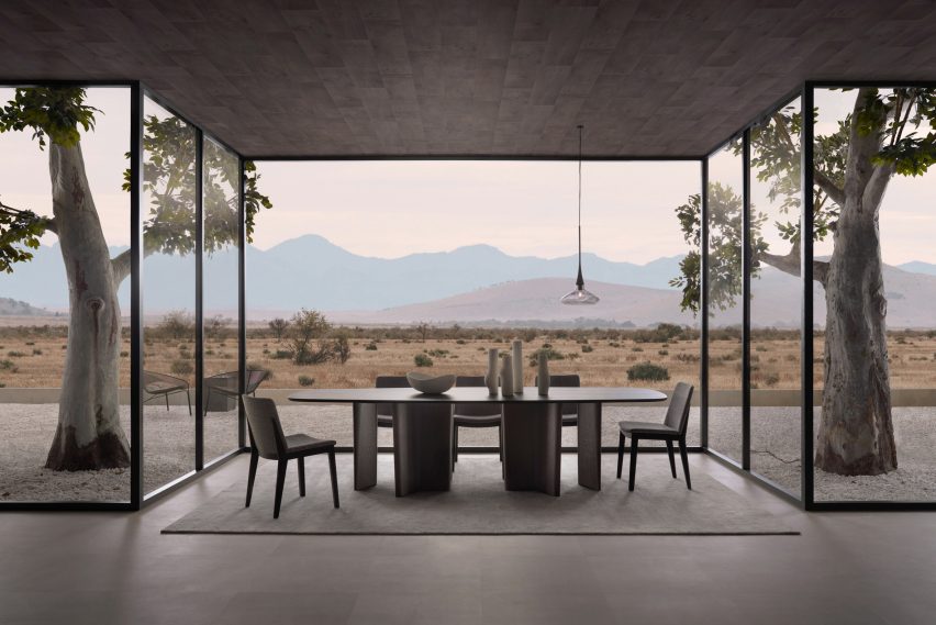 Image of the Issho dining table against a mountainous view