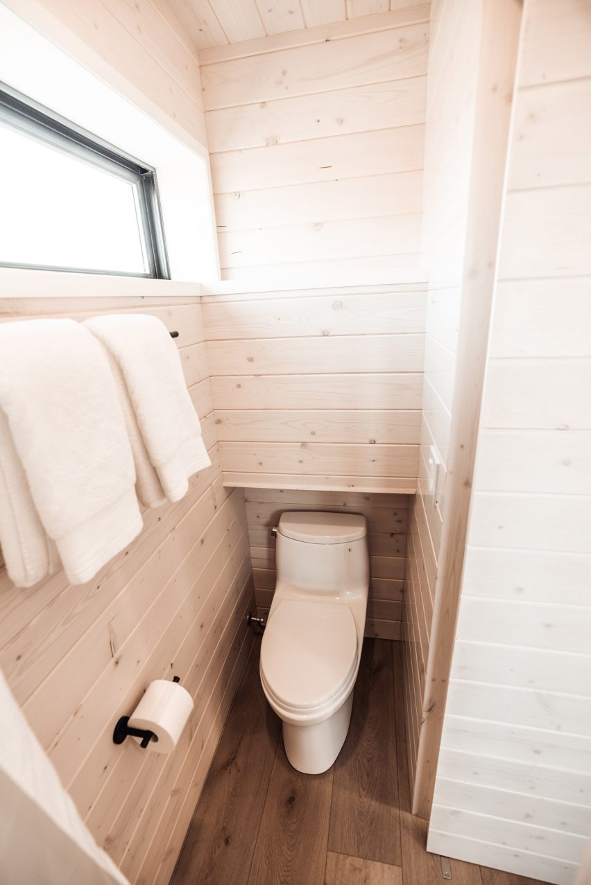 Mobile home bathroom with white-washed pine