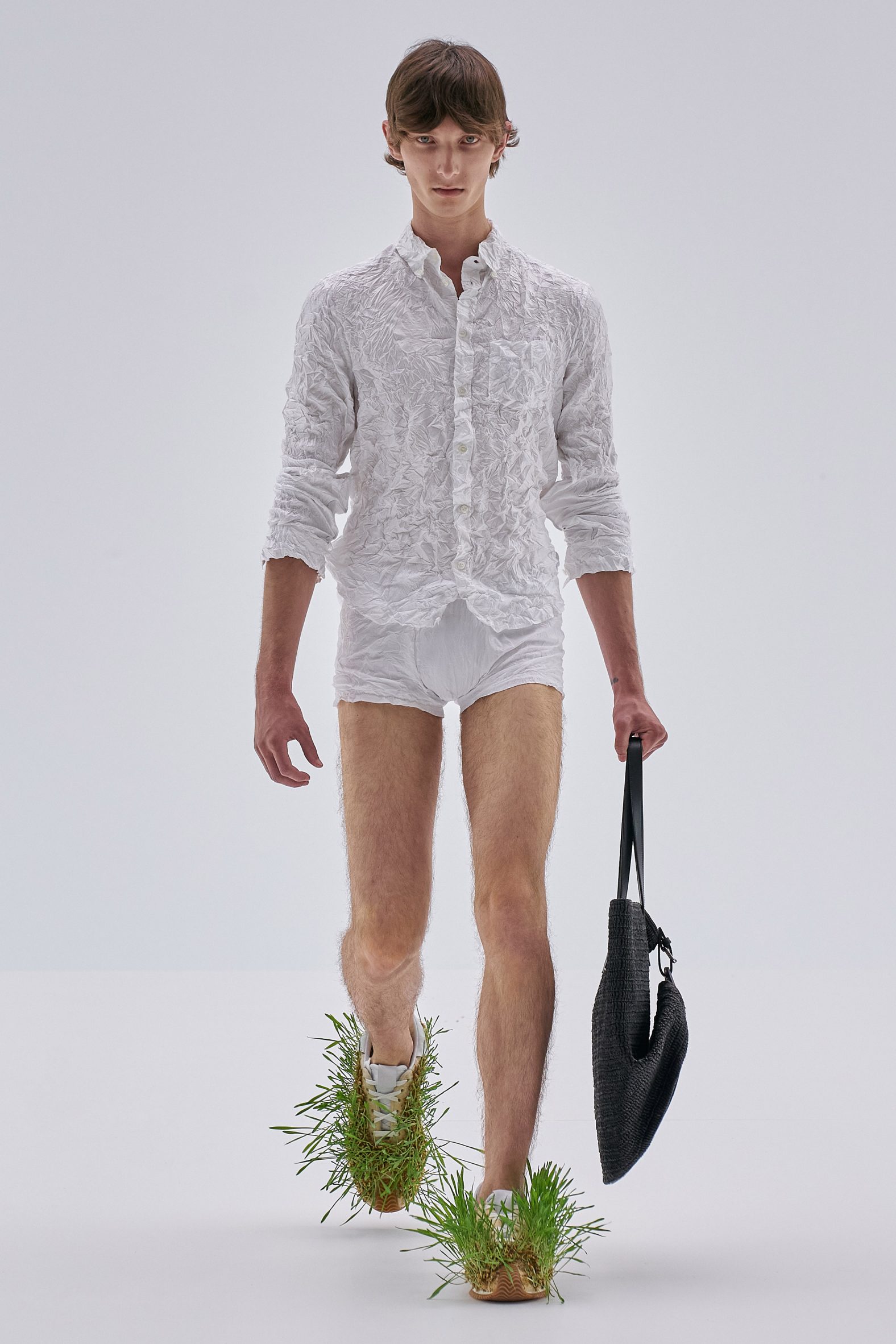 Loewe sprouts grasses and plants from sodden clothes at Paris Fashion Week
