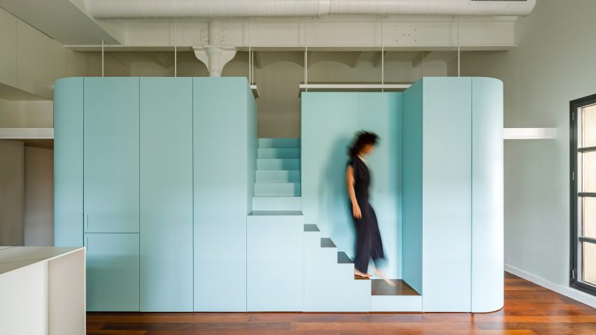 Woman deciding stairs in Loft in Poblenou by Neuronalab