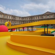 Louis Vuitton inserts yellow racetrack into Louvre courtyard for Spring Summer 2023 show