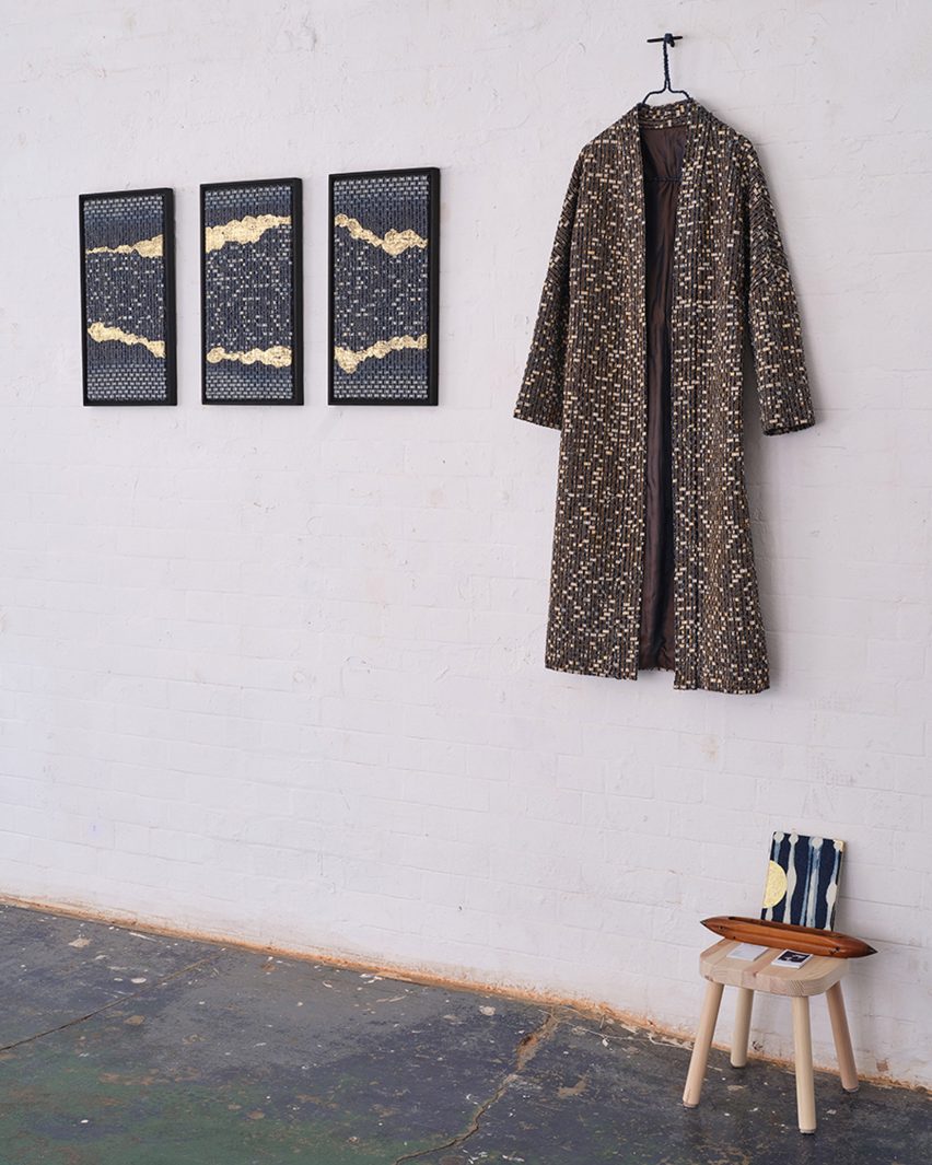 Momoka Gomi's textured kimono and prints hanging on a wall