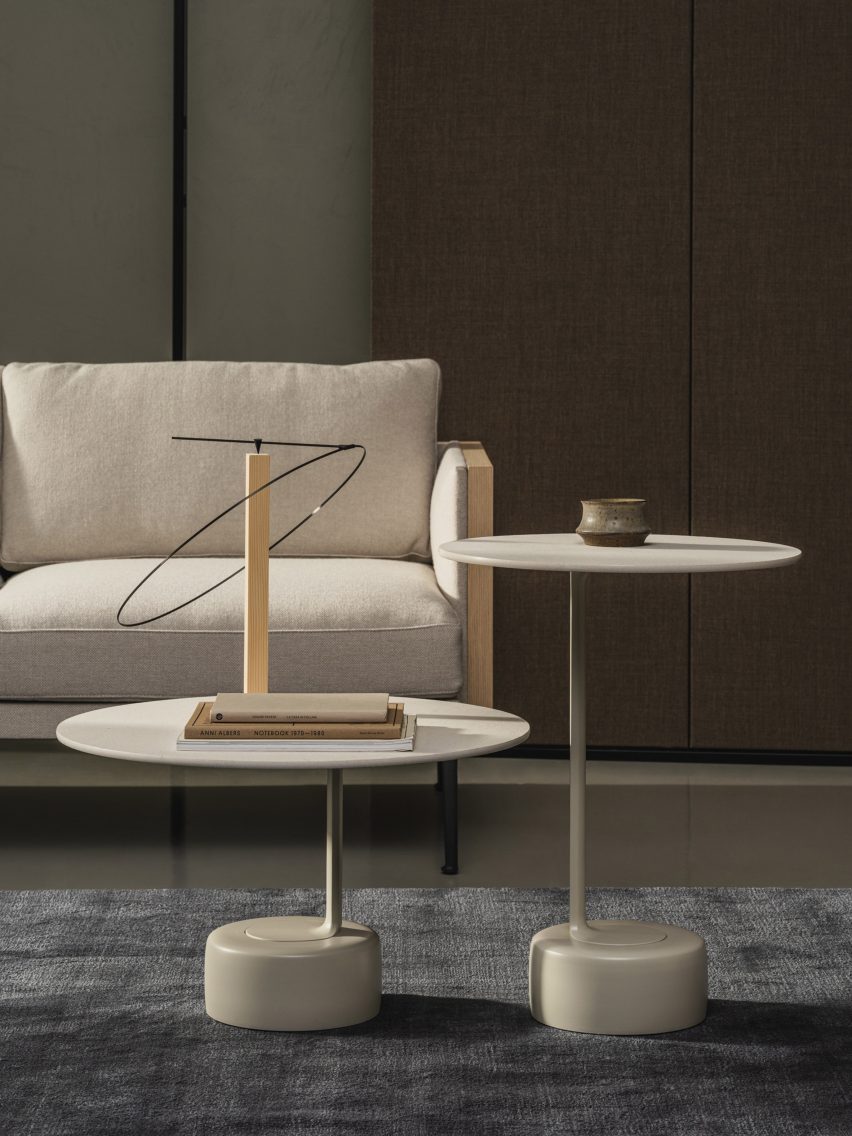 Two Oell side tables by Arper in front of a cream sofa
