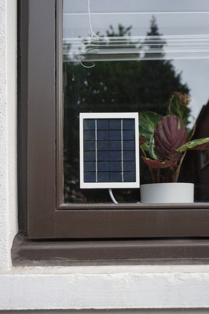 Solar panel stuck in the corner of a window