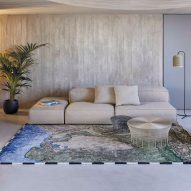 Indus river rug beside sofa in living room