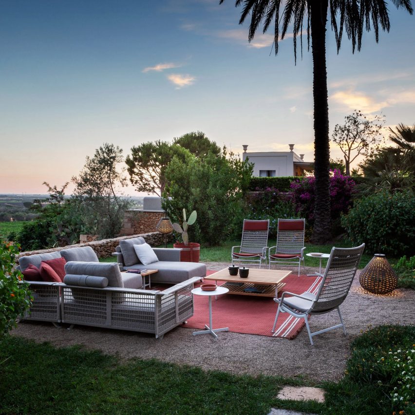 Poltrona Frau outdoor sofa, armchairs and lantern used in a garden