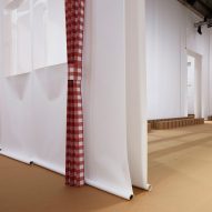 AMO creates oversized paper house for Prada Spring Summer 2023 show