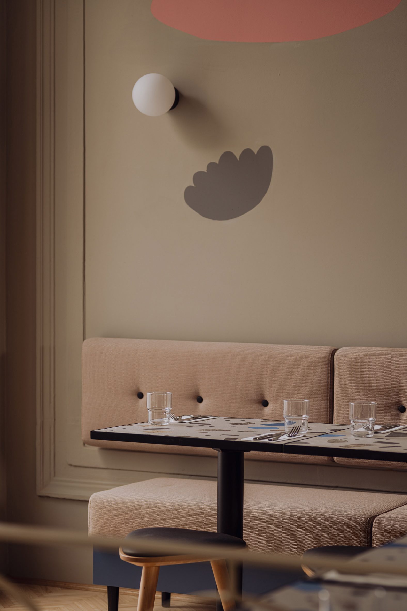Neutral toned seating area in Syrena Irena eatery