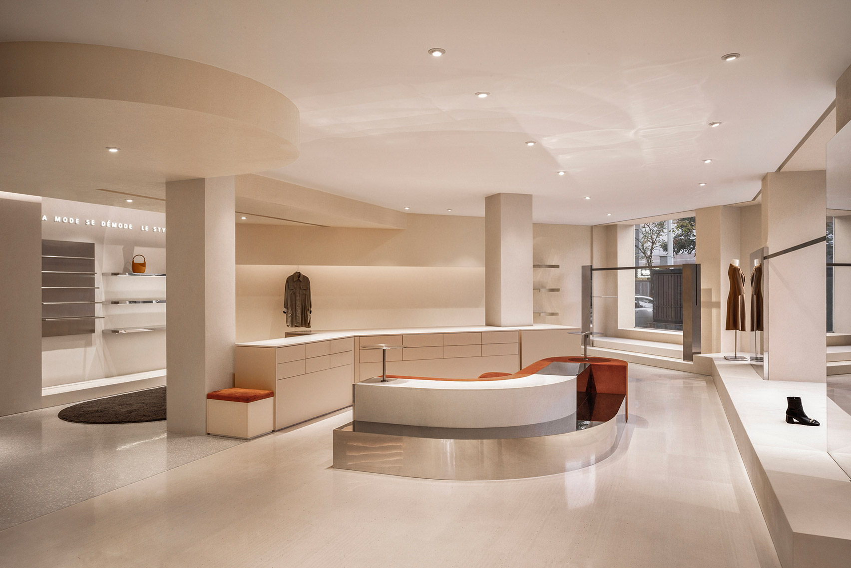 Interiors of QYF fashion boutique in Wuhan with curved metal bench