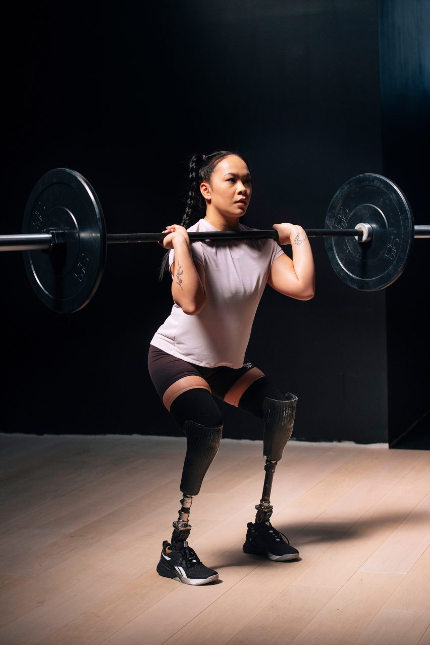 A woman lifting weights wearing Fit to Fit shoes