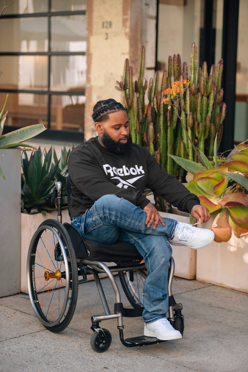 A man in a wheelchair wearing Reebok trainers
