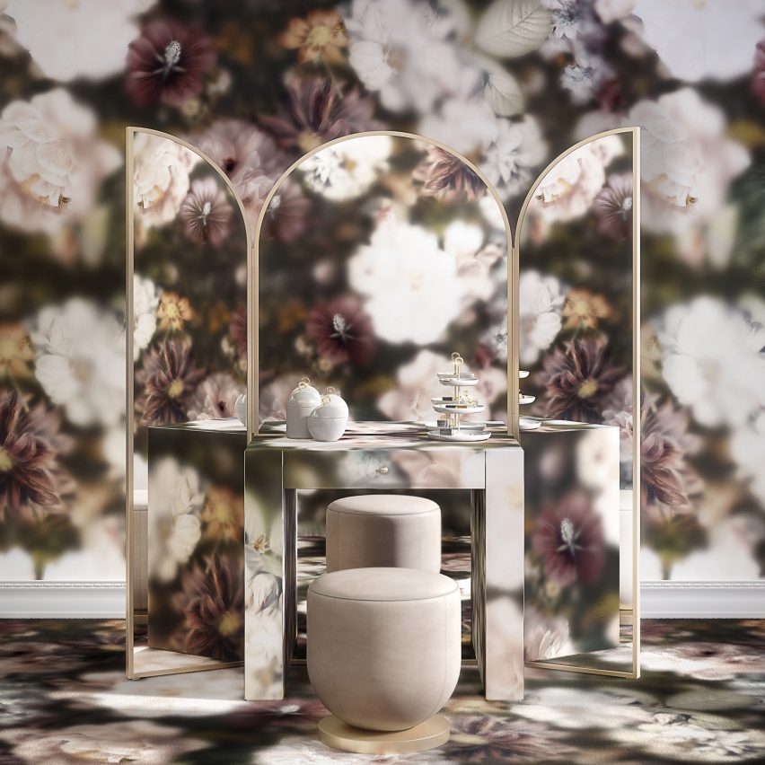 Vanity dressing table with mirrors reflecting large-print floral wall covering