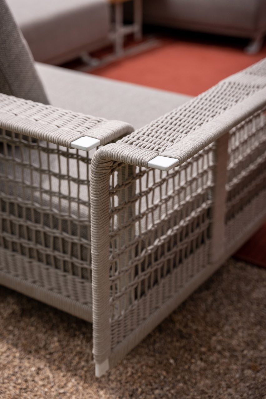 A grey sofa with woven sides