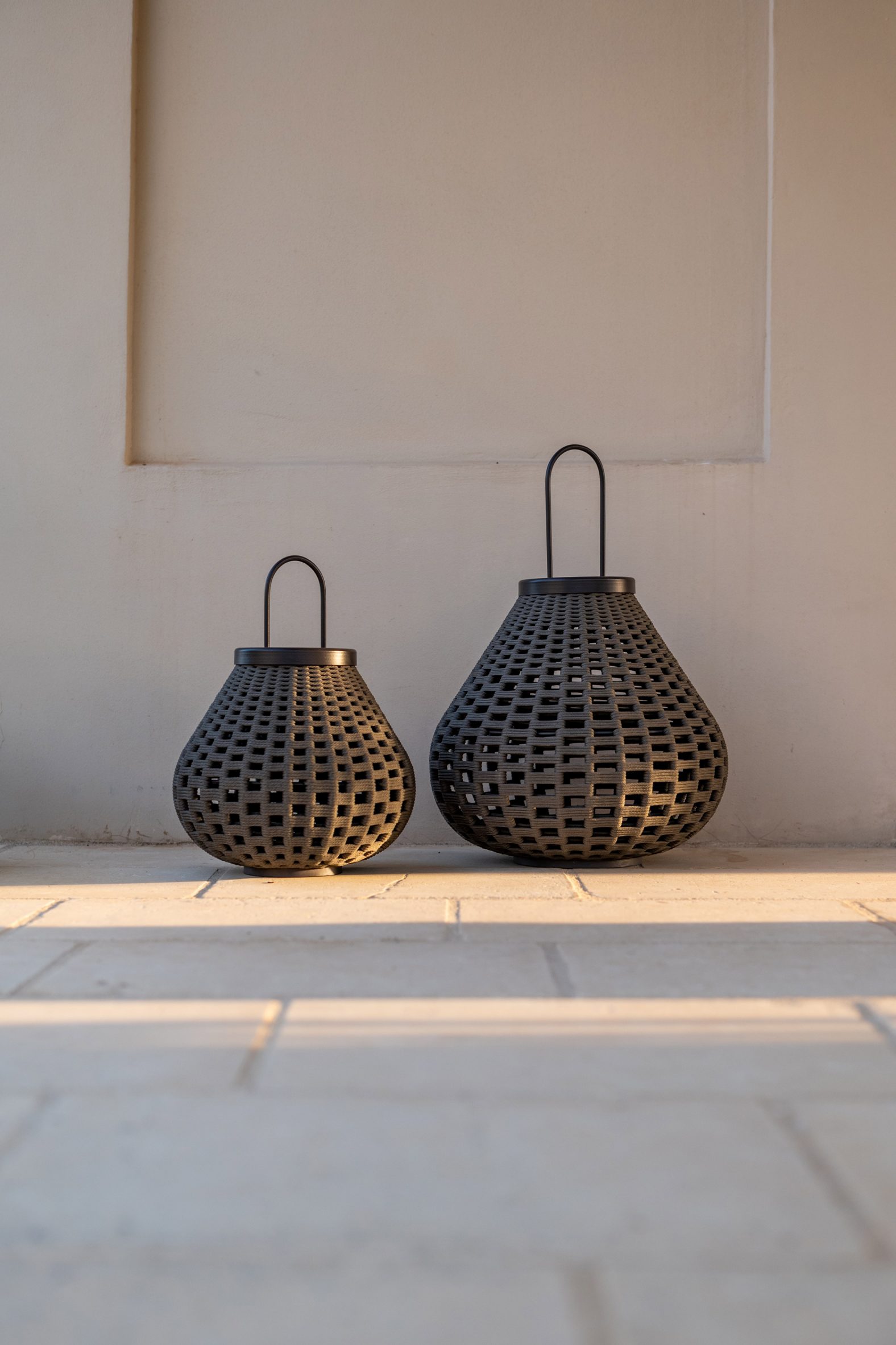 Two black pear-shaped lamps