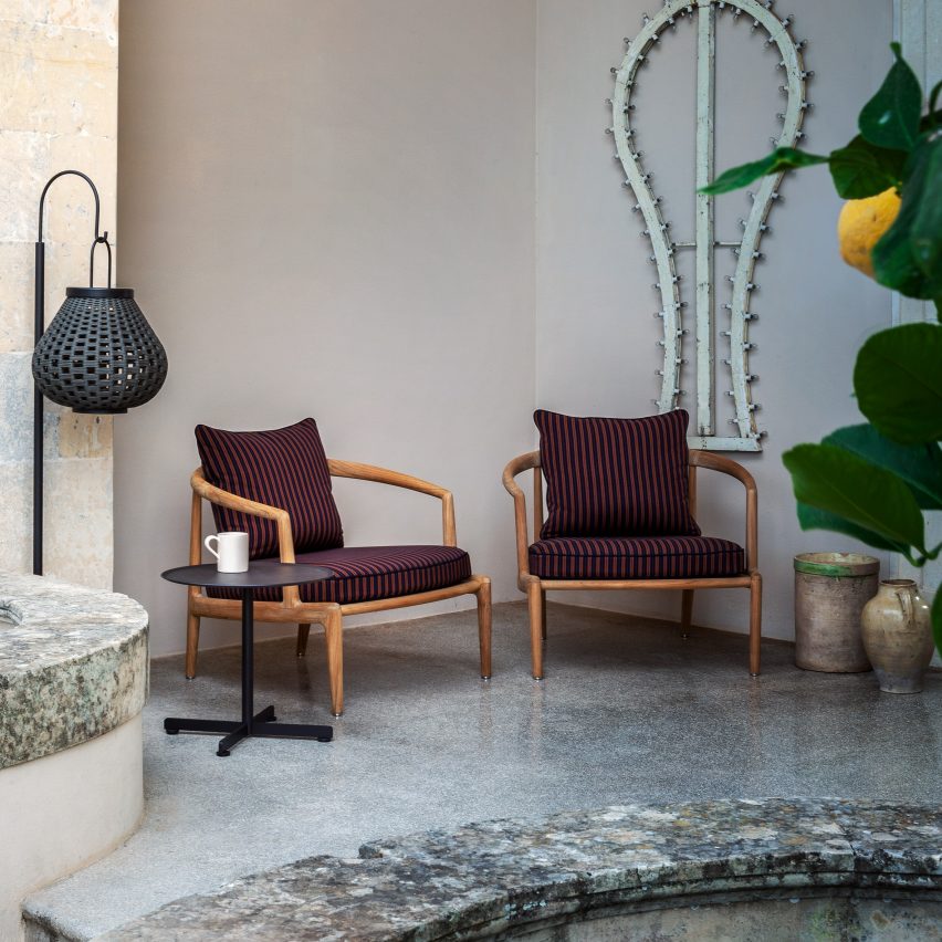 Two Poltrona Frau Secret Garden armchairs on a patio