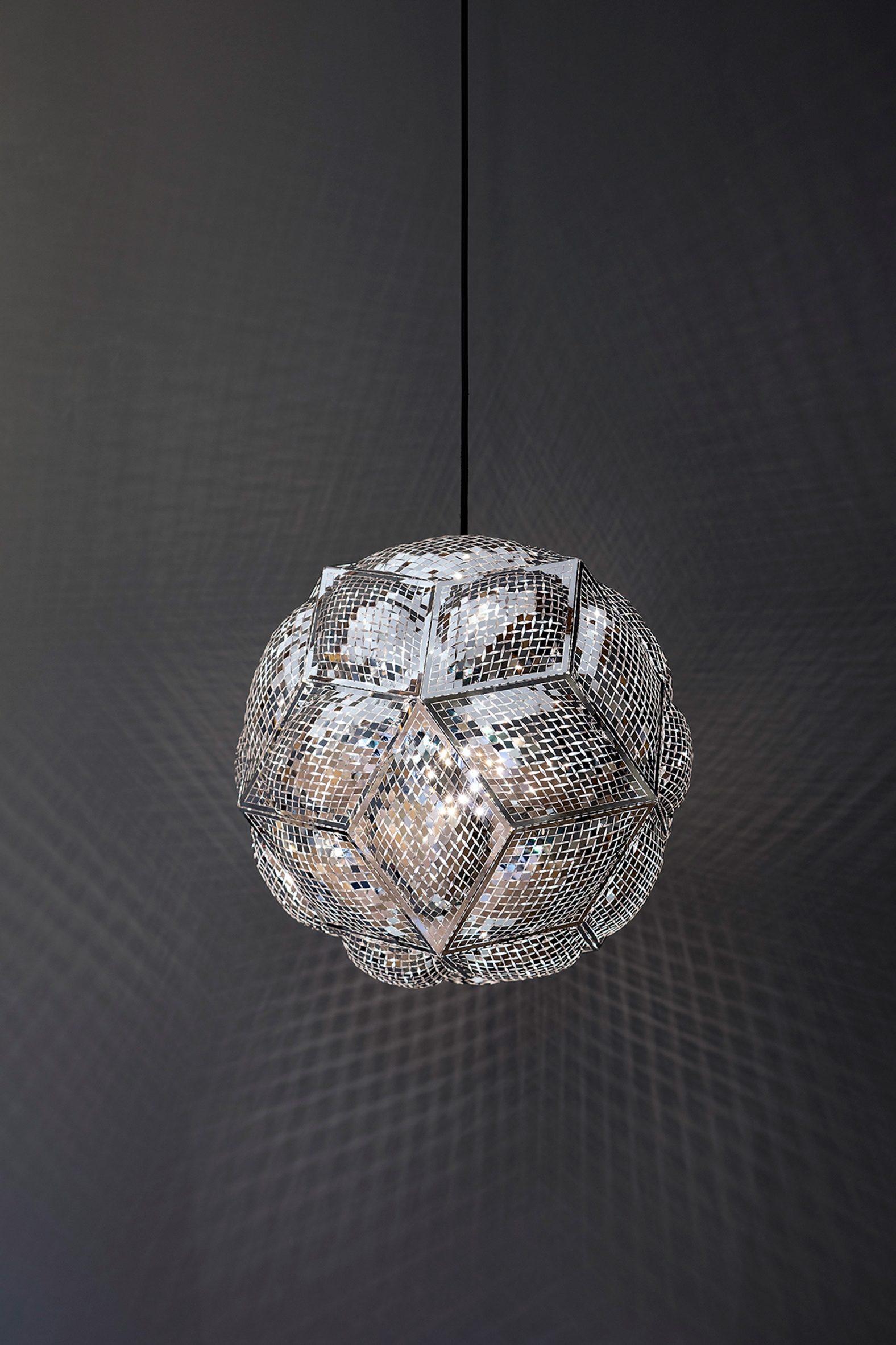 A metal lamp by Tom Dixon