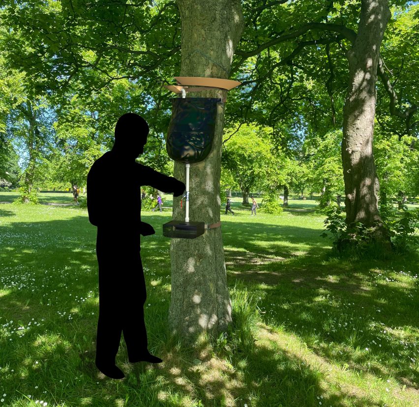 Man using hand-washing system attached to tree in outdoor environment