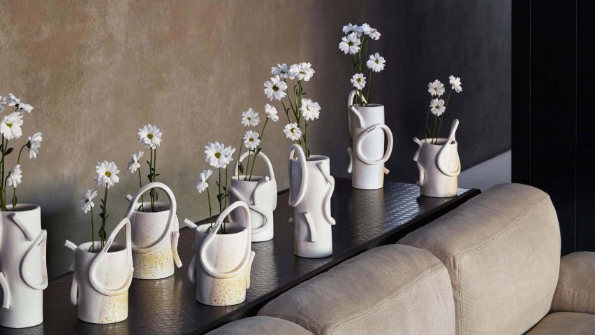 Image of Off-White ceramic vases filled with flowers
