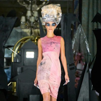 Photograph showing a catwalk model in pink dress