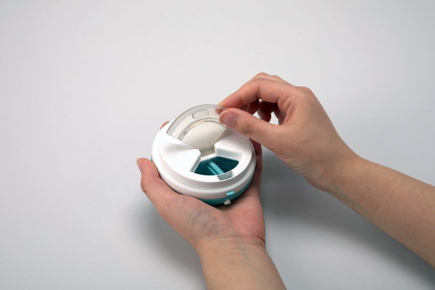 Liquid medication holder with compartments