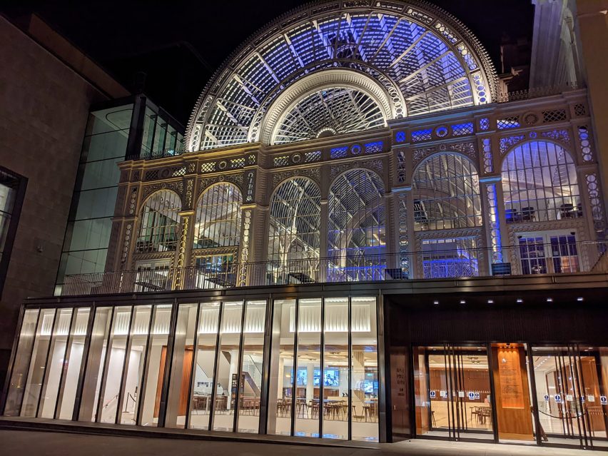 A photograph of the Royal Opera House lit up at night