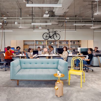 Photograph showing an industrial design studio with furniture and working spaces