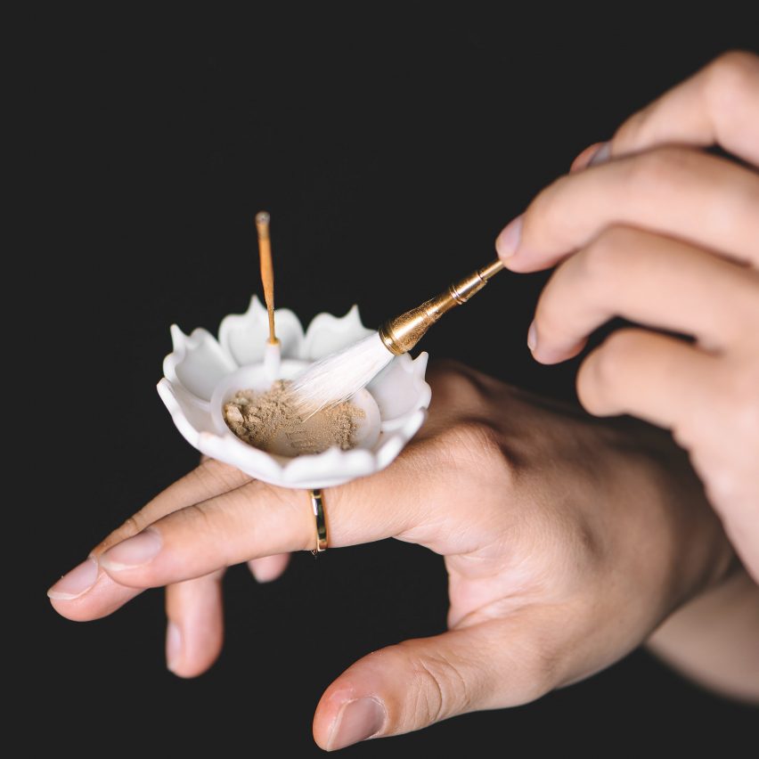 A flower-shaped dish on a ring the burns incense presented on Dezeen School Shows