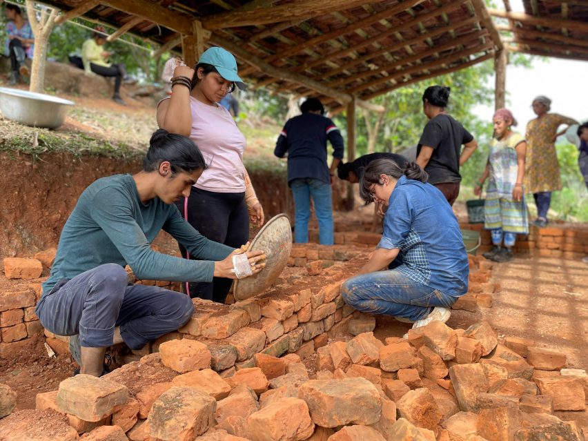 Builders laying bricks