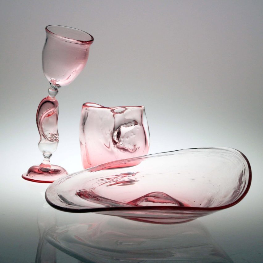 Three glass objects in shades of pink