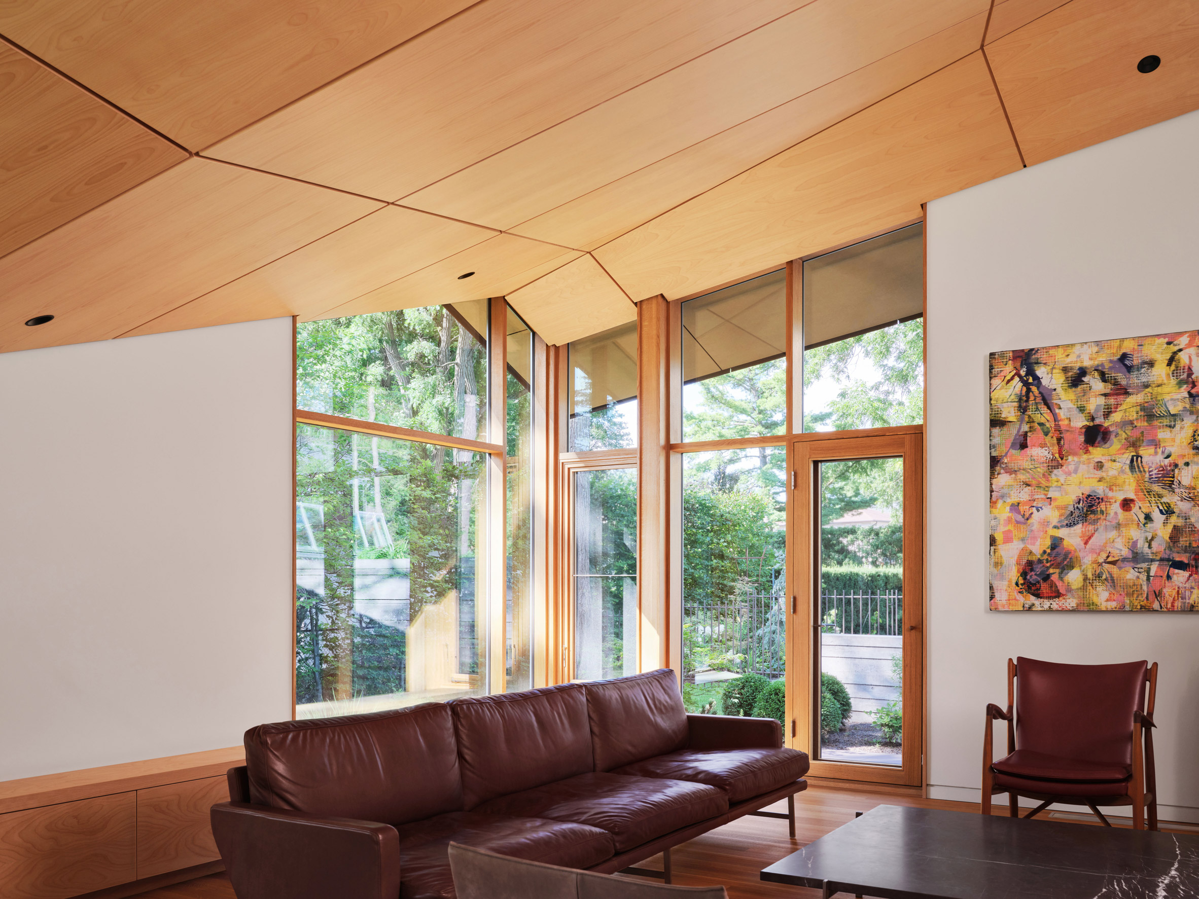 Living room with sloped wooden ceiling