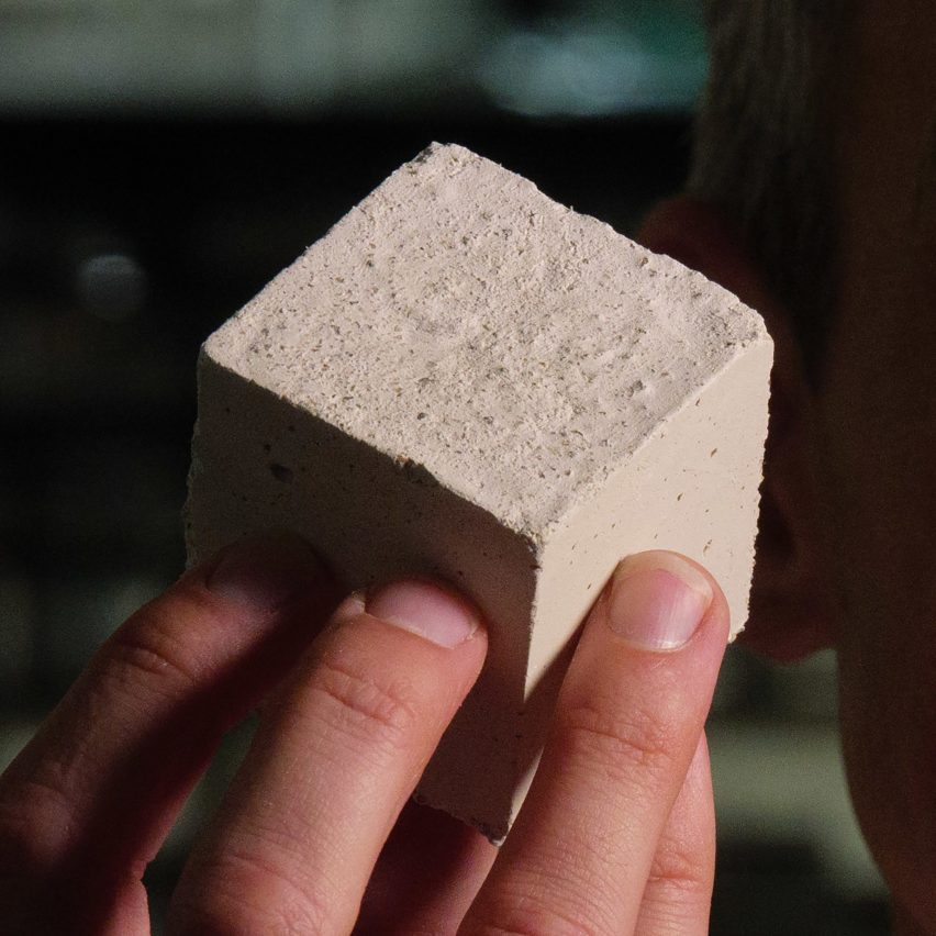 Cube of concrete made with algae-grown limestone
