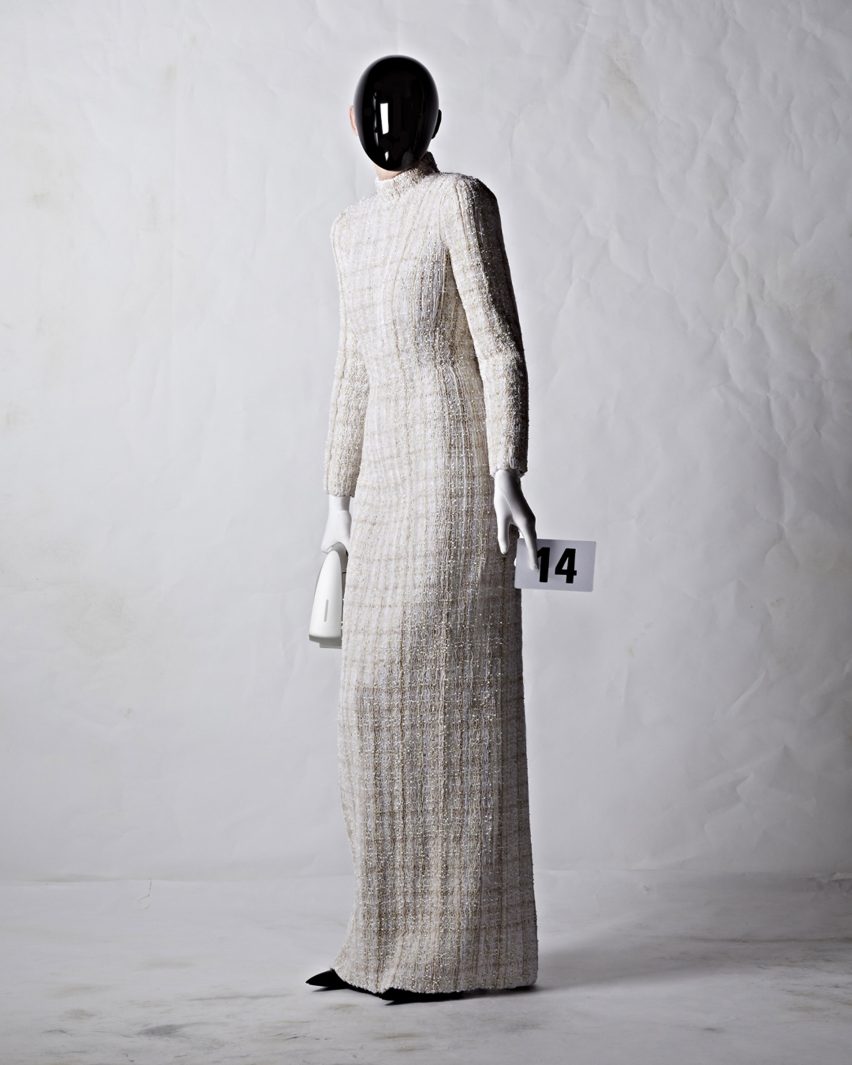 A model wearing a white dress by Balenciaga