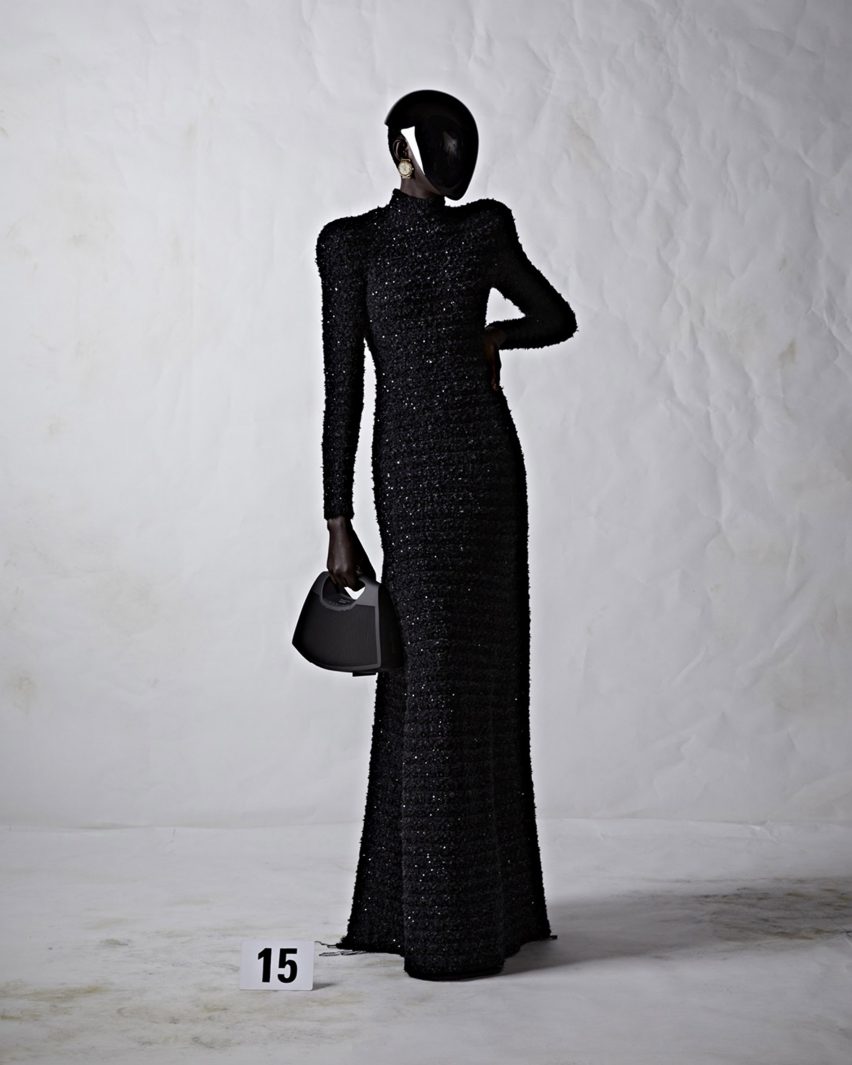 A model holding a black Speaker Bag