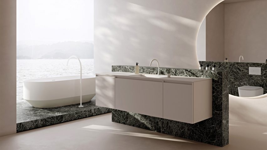Vallone wall mounted double basin and free standing bathtub on a green marble slab