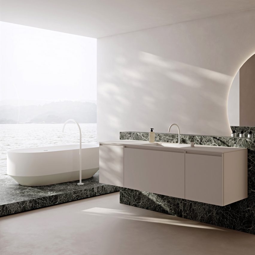 Vallone wall mounted double basin and free standing bathtub on a green marble slab