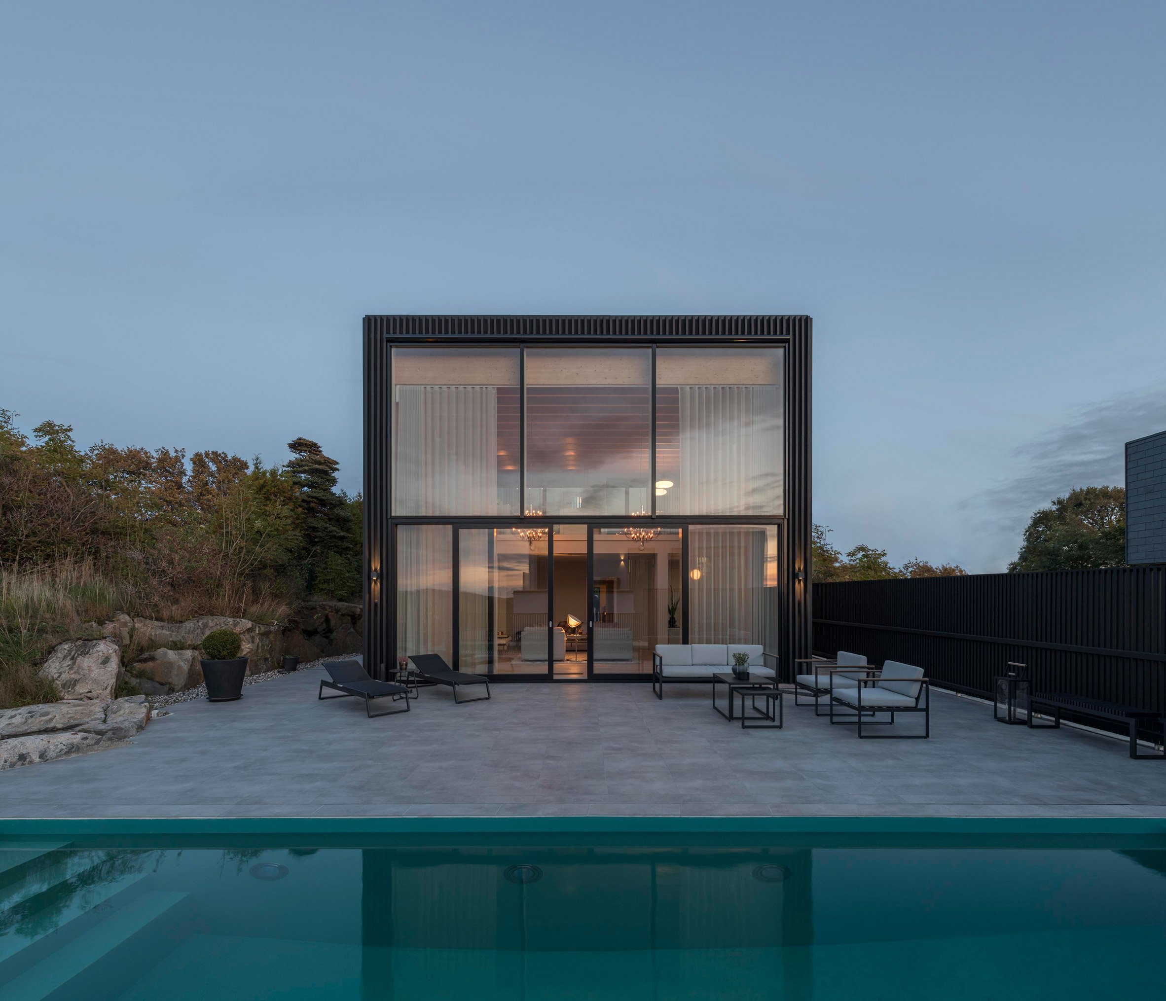 Exterior of Swedish house with pool by Bornstein Lyckefors