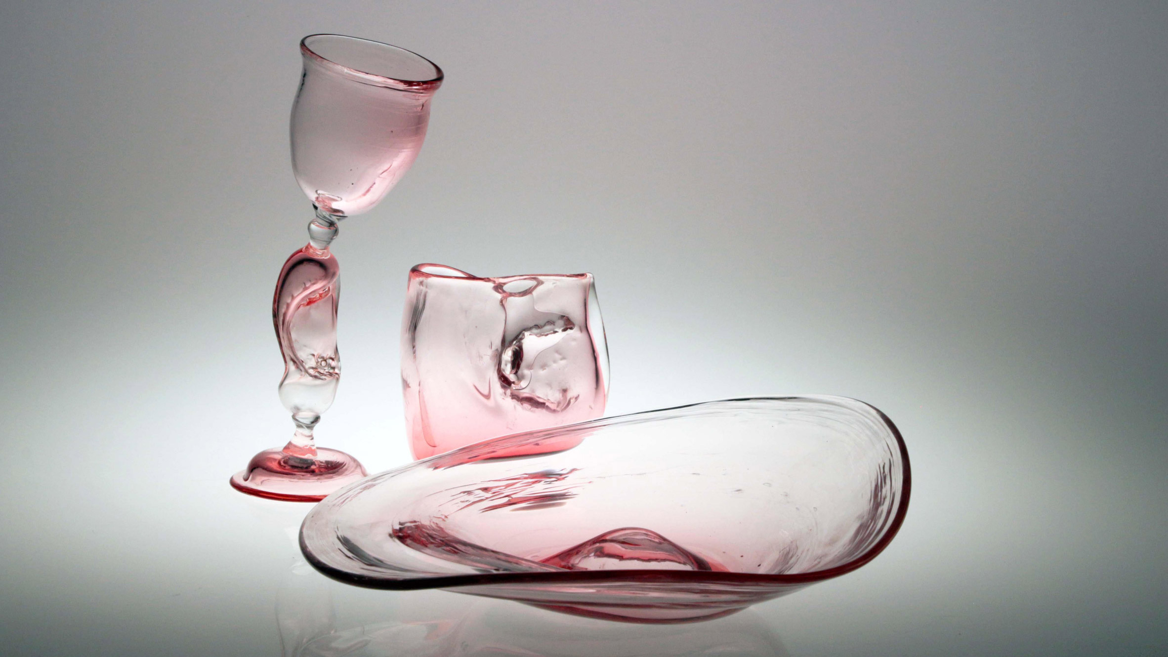 Fluid-shaped pink glassware presented on Dezeen School Shows