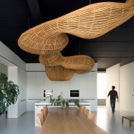 Office interior with rattan ceiling sculpture