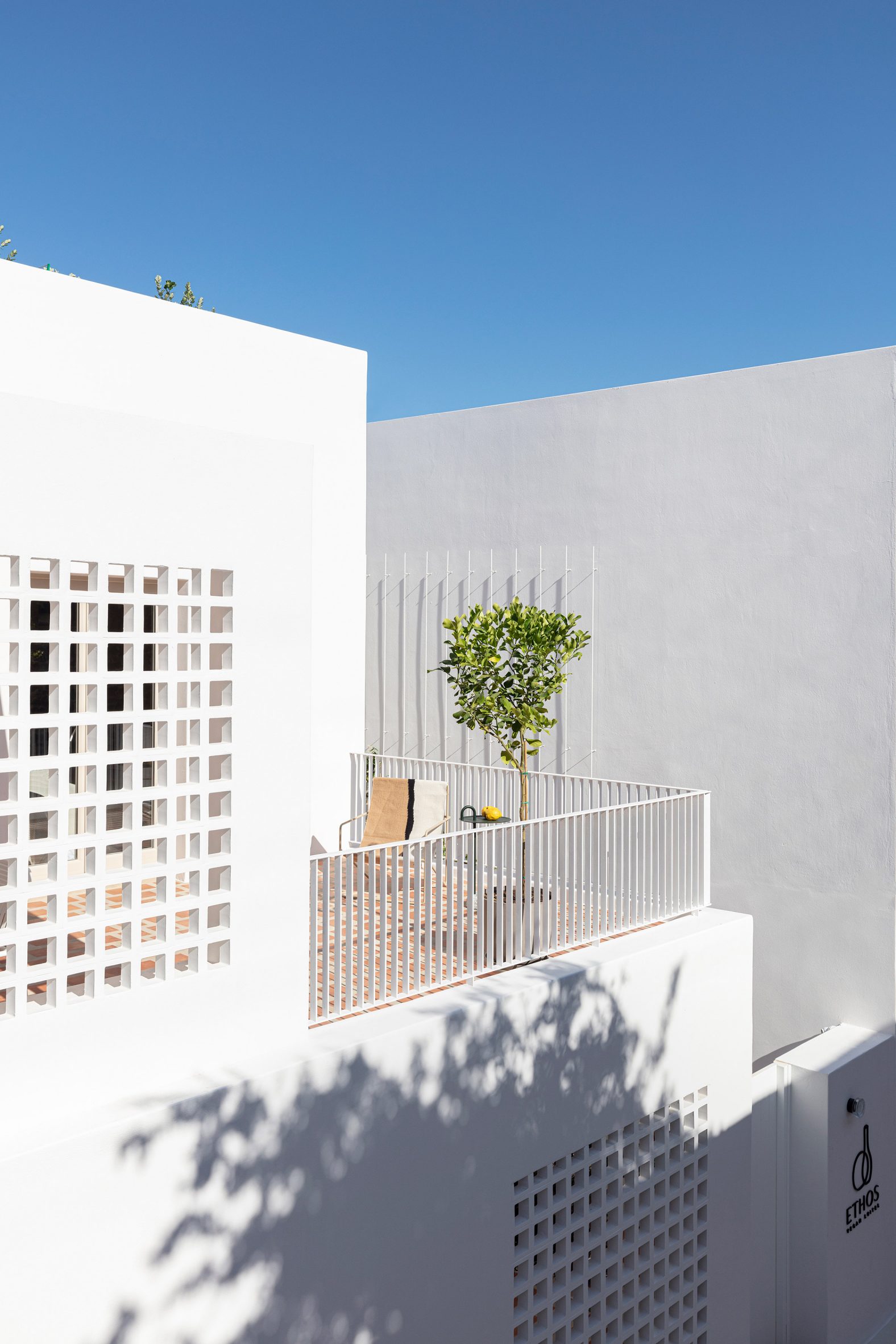A cubist-style white building in Santorini