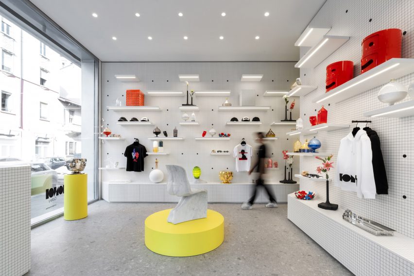Bright interior of Fabio Novembre's Milan concept store with yellow plinth and white walls