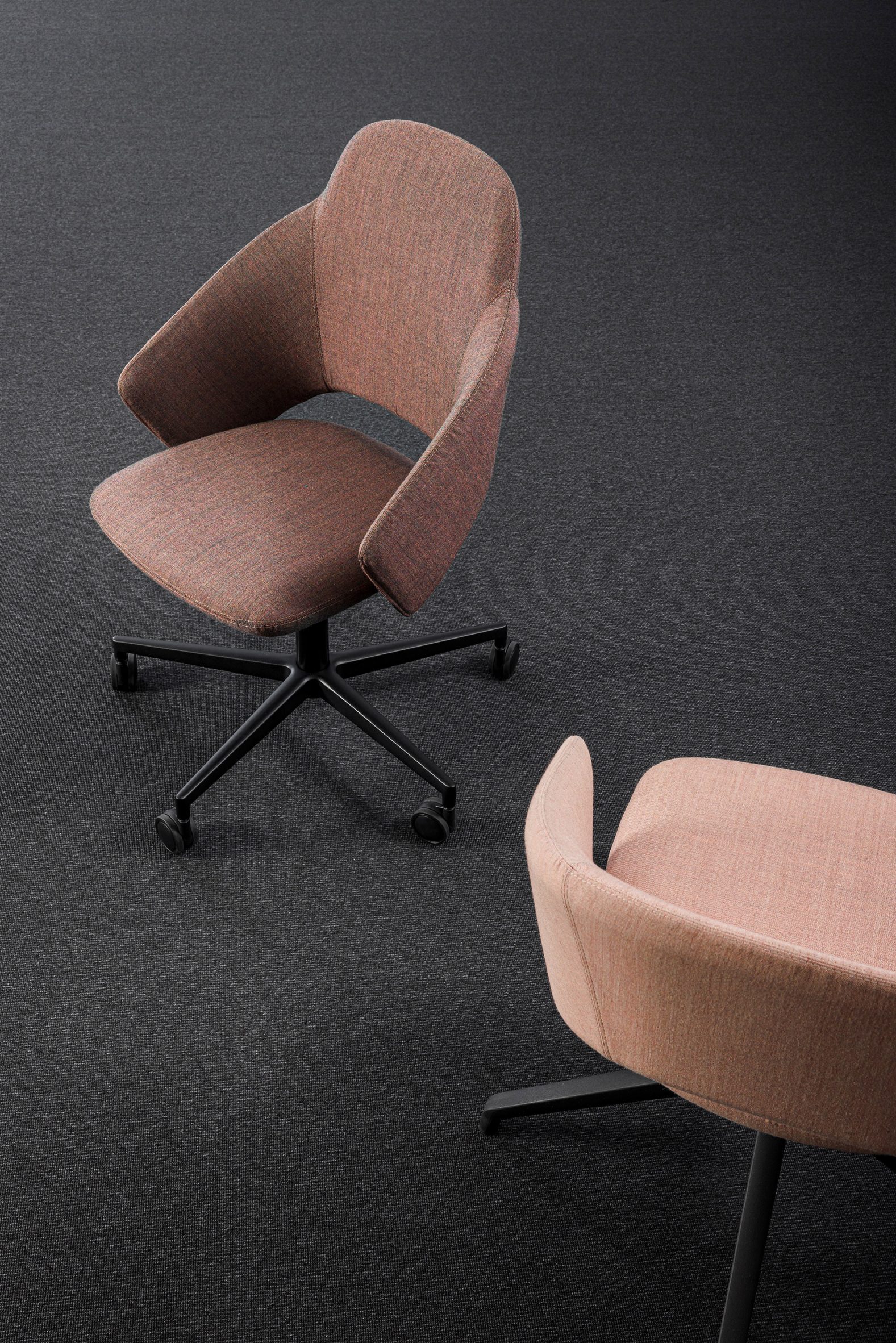 Two pink Icon swivel chairs with high and low back