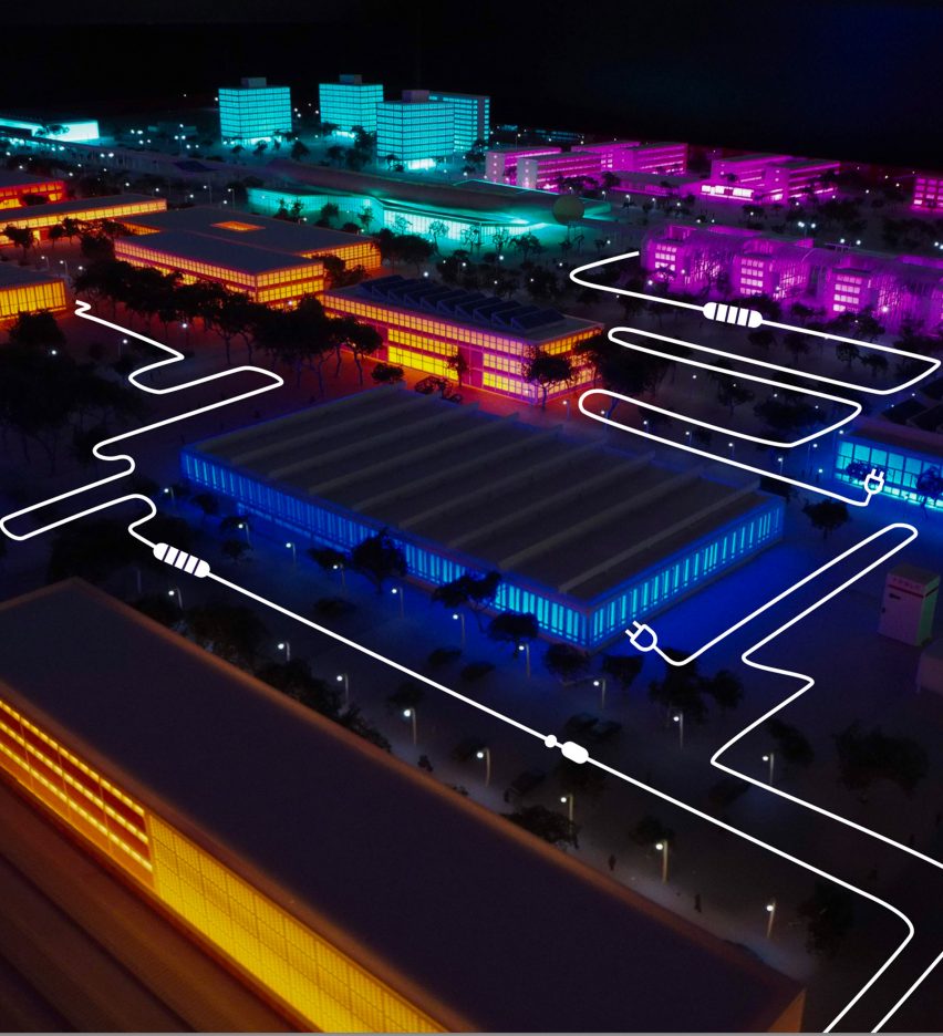 Aerial of buildings lit up in colourful lights